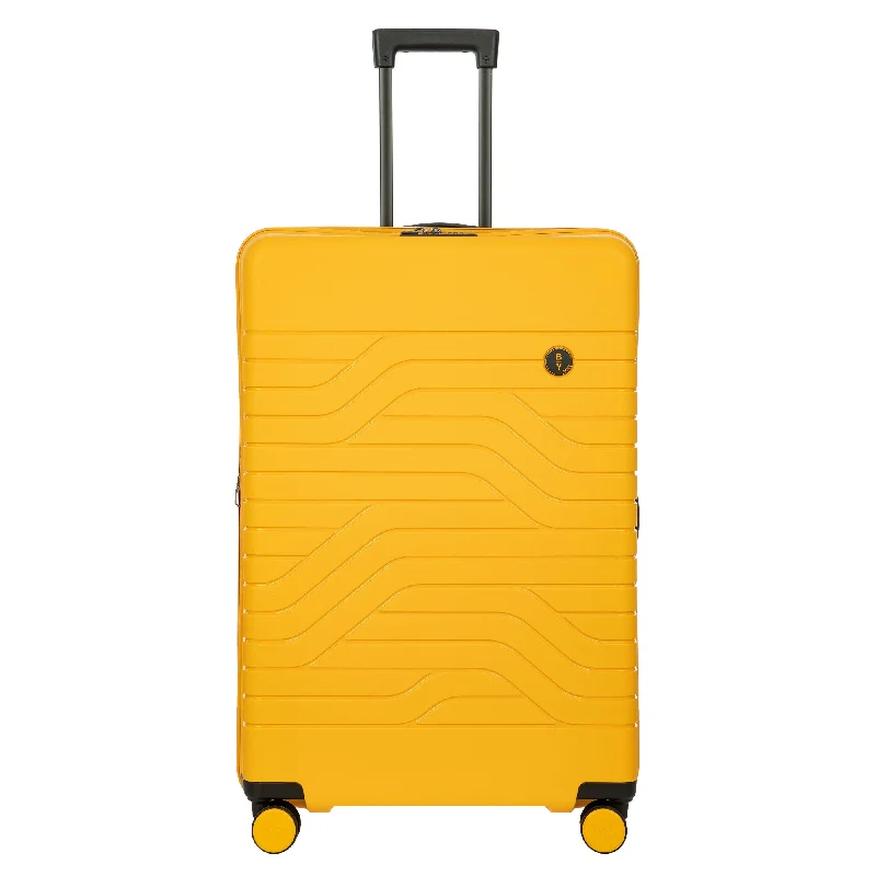 Travel - Size Toiletry Bottles with Leak - Proof Caps in ClearBric's B Y Ulisse Expandable Spinner - 30" Mango