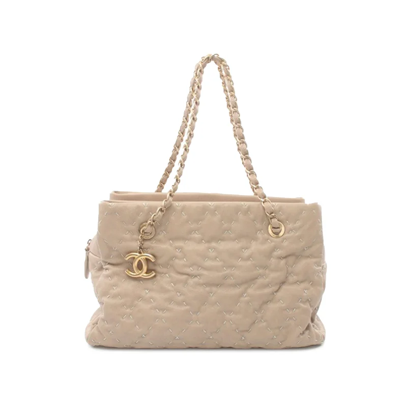 Linen Tote Bag in Natural Beige with Braided Details for a Rustic Summer EnsembleBrown Chanel CC Caviar Wild Stitch Tote