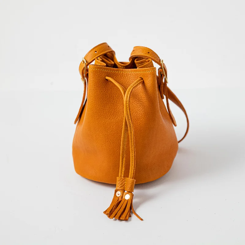 Denim Bucket Bag in Washed Blue with Patchwork for a Vintage - Inspired LookOrange Cypress Bucket Bag