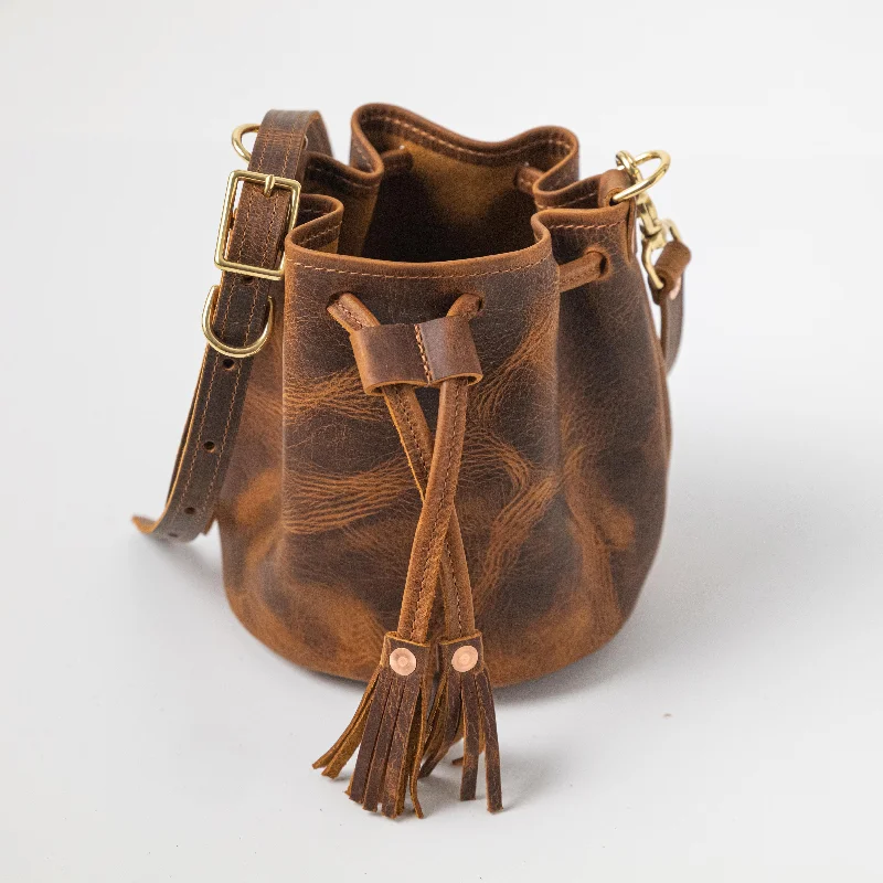 Metallic Bucket Bag in Rose Gold with Chain Strap for a Trendy Party LookTobacco Bucket Bag